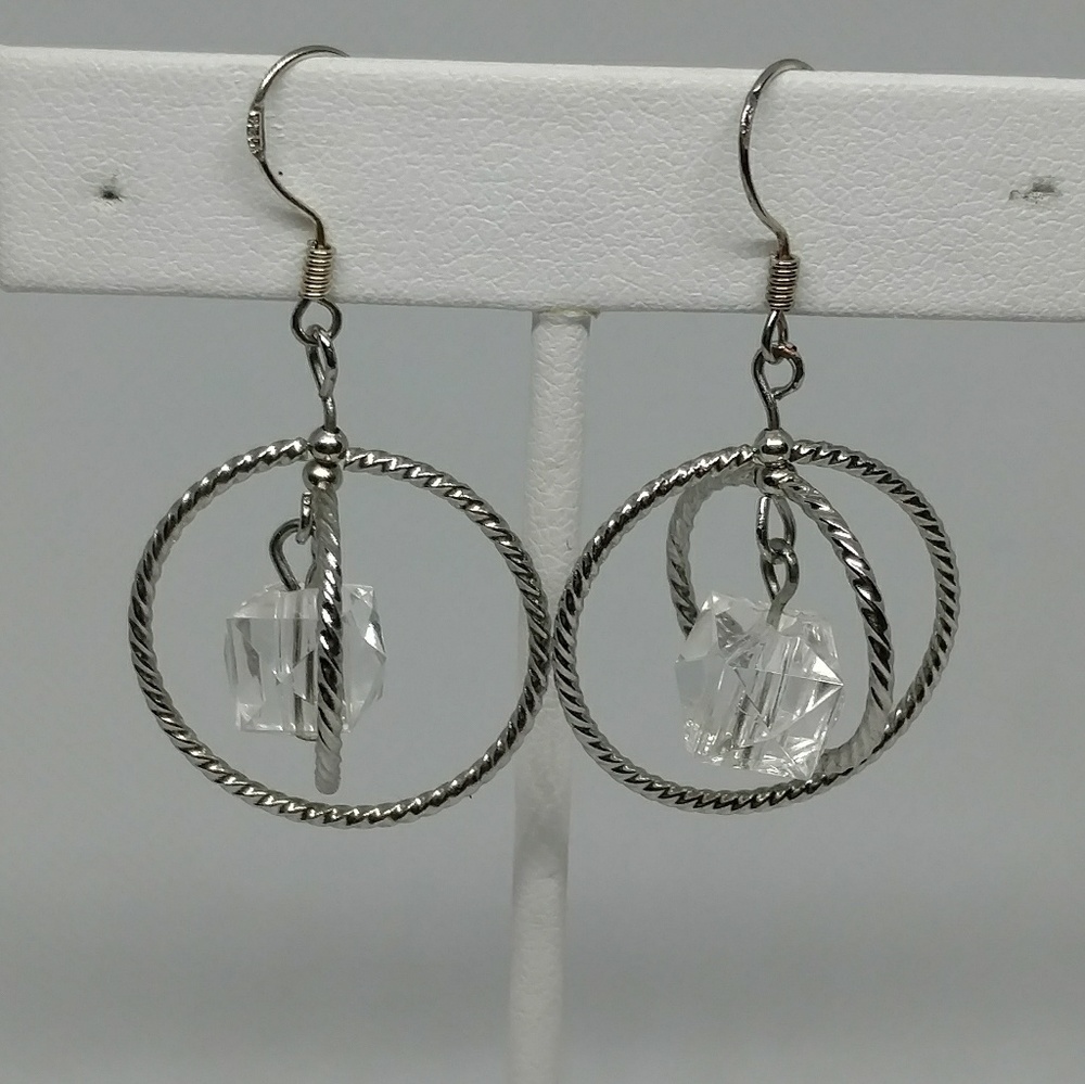Silver tone earrings with clear acrylic pendant